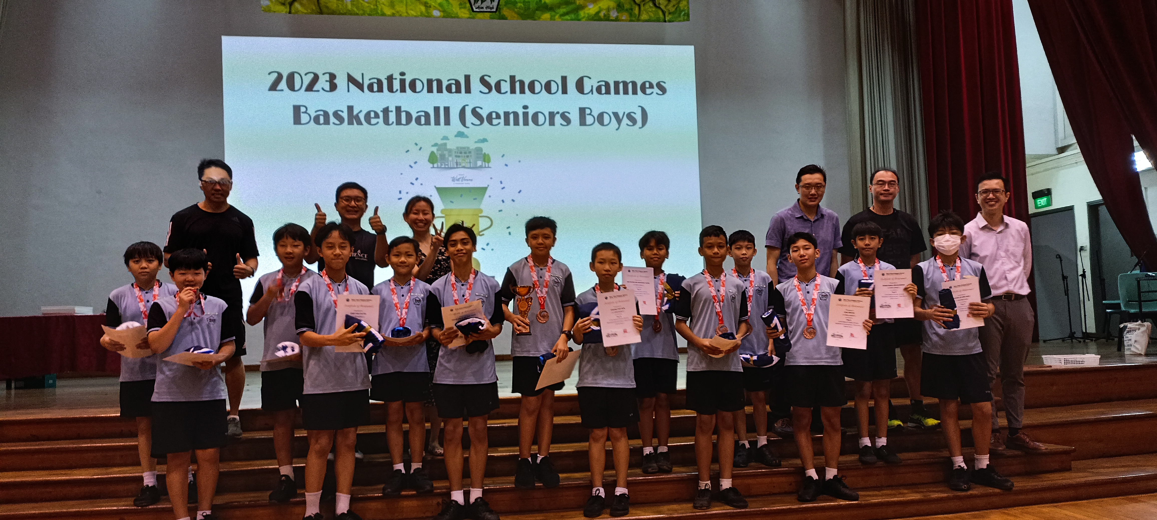 A photo of our 15 basketball senior boys posing with a certificate